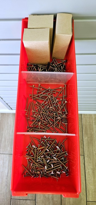 Red Shelfbox 400 with dividers and screws, from above