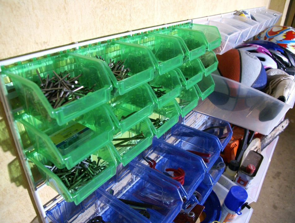 Green and blue Hobiboxes holding screws and other sports equipment