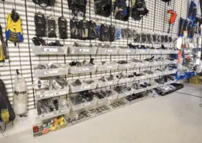 A variety of Slatbox holding different mechanical parts on Gridwall
